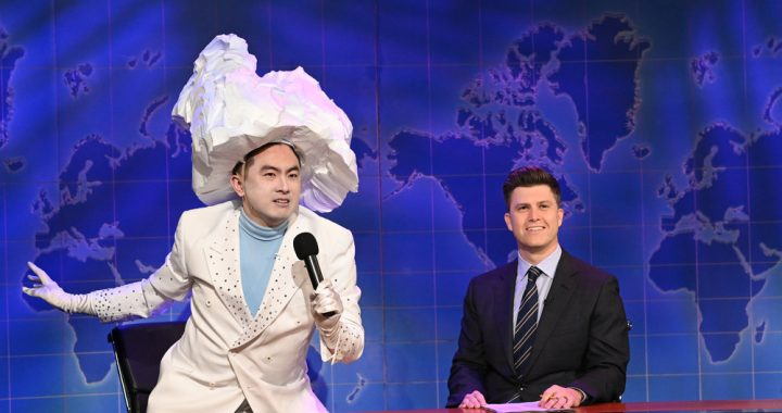 SATURDAY NIGHT LIVE -- "Carey Mulligan" Episode 1802 -- Pictured: (l-r) Bowen Yang as 'The Iceberg That Sank The Titanic' and anchor Colin Jost during Weekend Update on Saturday, April 10, 2021 -- (Photo by: Will Heath/NBC)